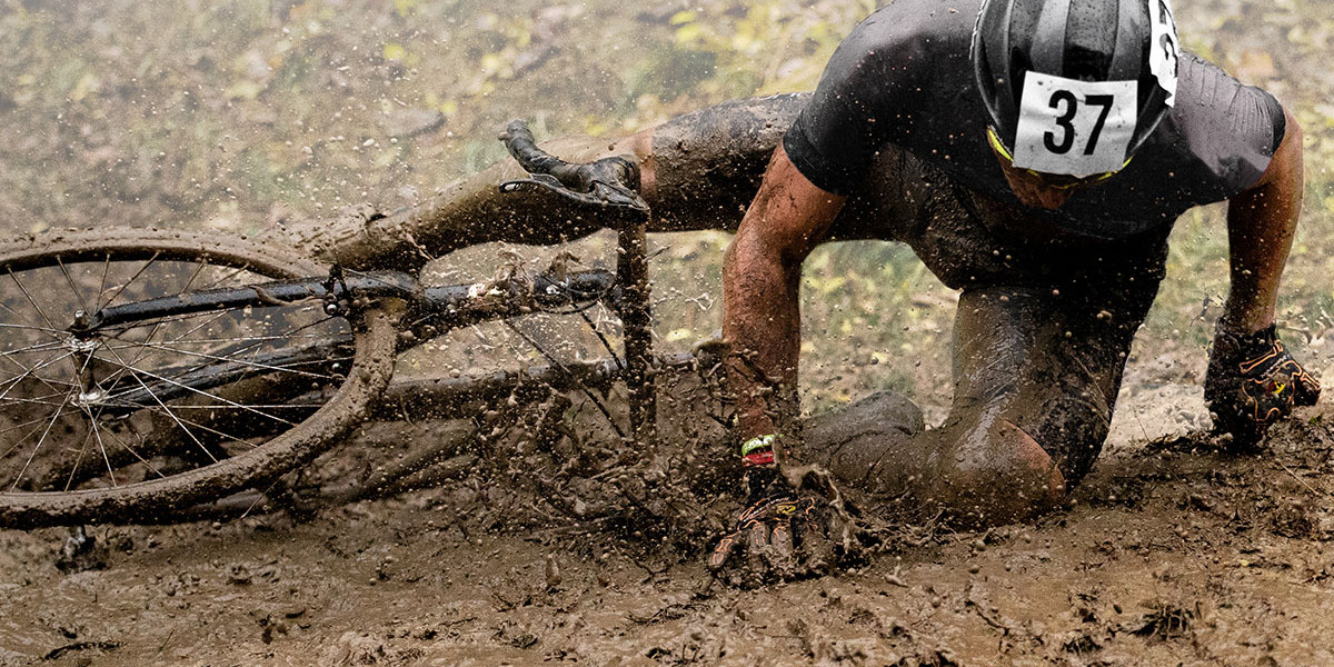 Cyclist on a muddy trail